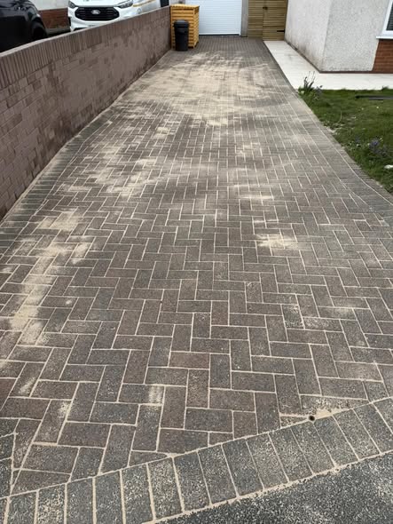 Driveway after cleaning and re-sanding with a sharper block paving finish