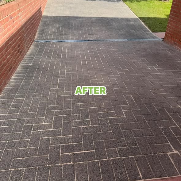 Driveway and patio cleaning result showing a darker, tidier block paving finish